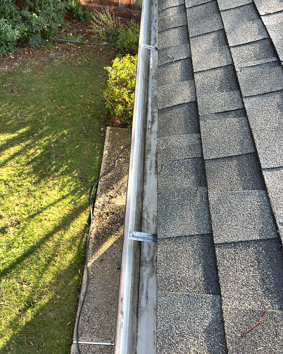 Packed gutter, cleared by hand, after cleaning